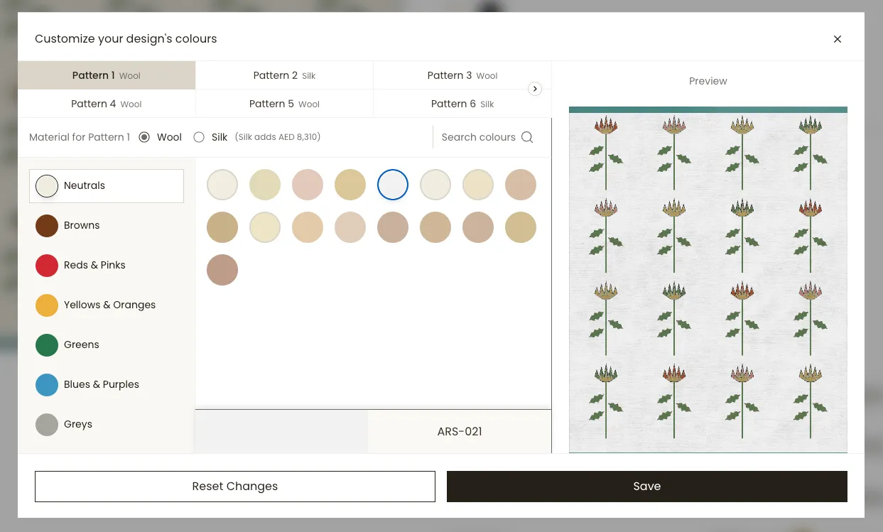 The Detara customisation screen, where each pattern element of a rug design can be set to wool or silk and recoloured from a palette of swatches, with a live preview